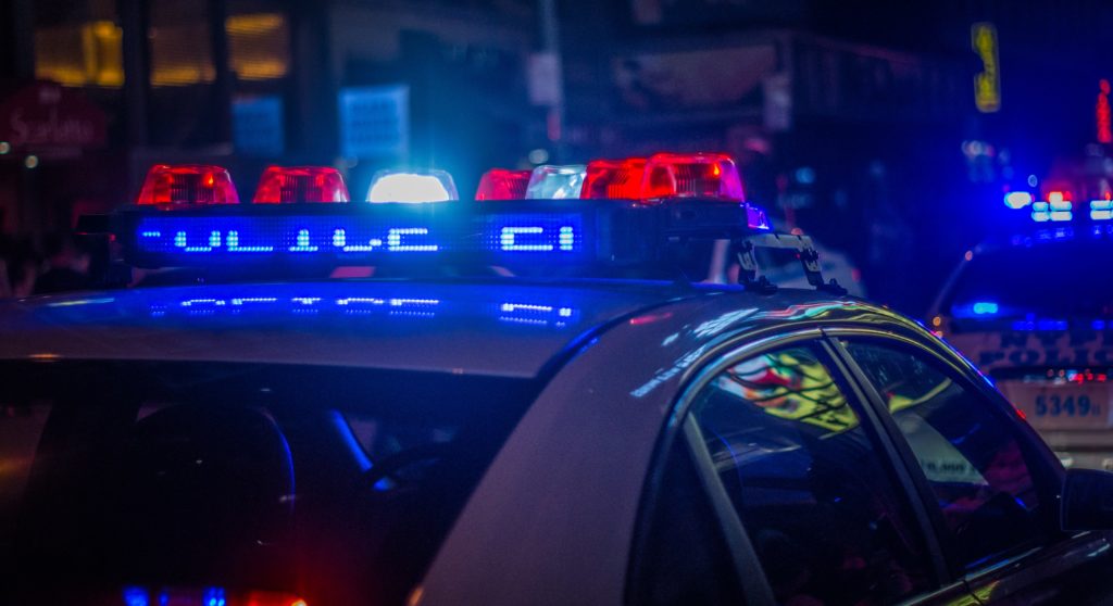 cop car felony misdemeanor blue red lights flashing